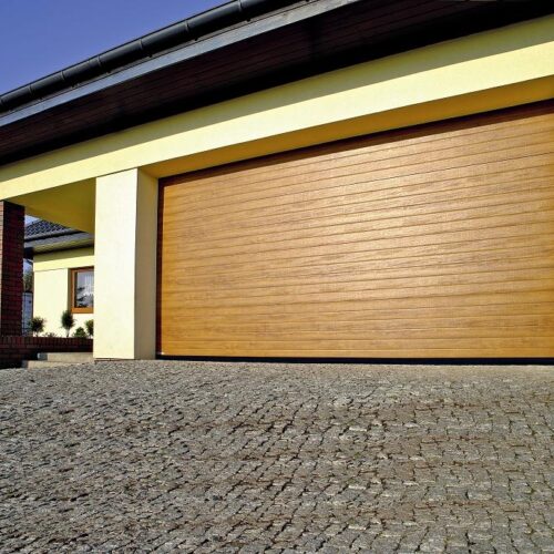 Nowoczesna brama garażowa segmentowa w kolorze dębu - profesjonalny montaż Ronix II Lędziny